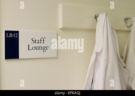 Lab coat at staff lounge in hospital laboratory. Stock Photo