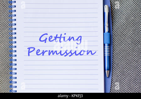 Getting permission write on notebook Stock Photo