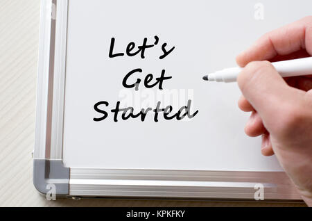 Let's get started written on whiteboard Stock Photo