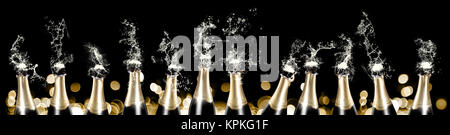 Foaming and splashing champagne bottles panorama Stock Photo