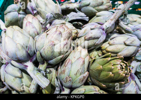 Fresh artichokes in a Spanish supermarket Stock Photo