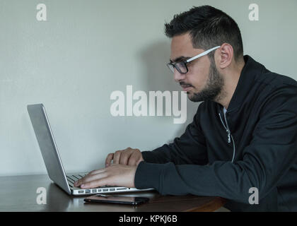 Young business man multitasking Stock Photo