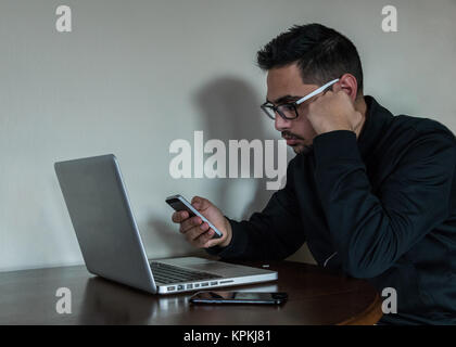 Young business man multitasking Stock Photo