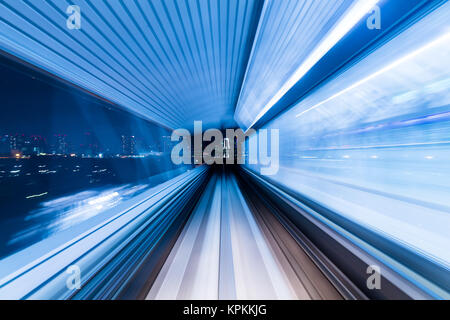 Train moving fast in tunnel Stock Photo