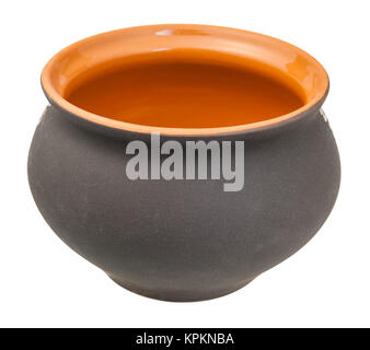 open ceramic pot from black unglazed clay isolated Stock Photo