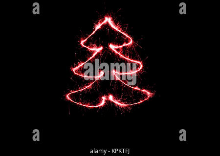 red christmas tree made by sparkler on a black background Stock Photo
