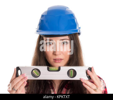 female artisan with water level looks skeptical Stock Photo