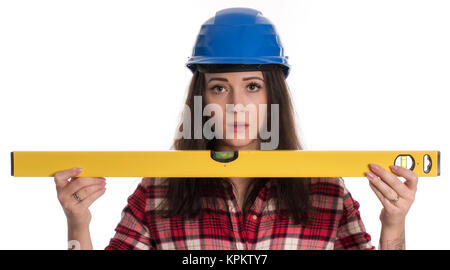 young woman with safety helmet holding a spirit level Stock Photo