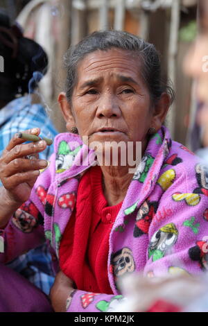 smoking old woman from burma when cigars Stock Photo