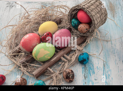 Happy Easter multi-colored eggs on wooden bacground Stock Photo