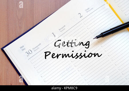 Getting permission write on notebook Stock Photo