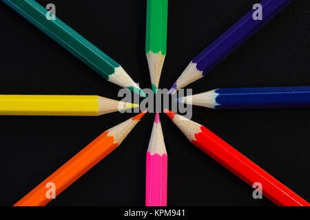 Collection of colored pencils on black background. Stock Photo