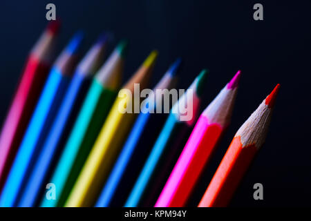 Closeup of colored pencils on dark background Stock Photo