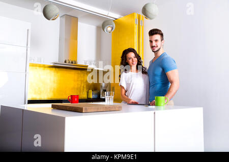 Young couple with a Tablet PC in the Kitchen. Stock Photo