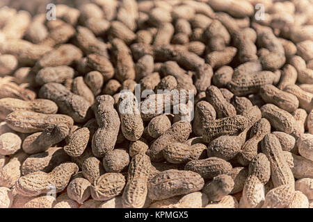 in the market lots of peanuts like concept of healthy food and snack Stock Photo