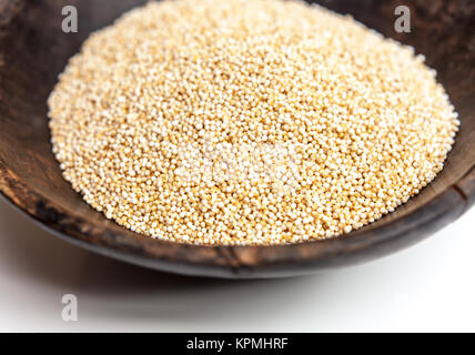 Amaranth puffed seeds in rustic wooden bowl isolated white background Stock Photo