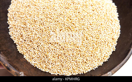 Amaranth puffed seeds in rustic wooden bowl isolated white background Stock Photo