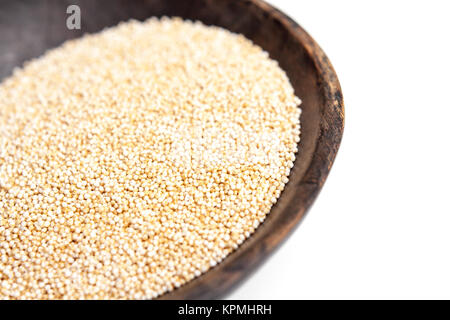 Amaranth puffed seeds in rustic wooden bowl isolated white background Stock Photo