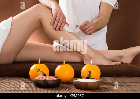 Woman Getting Her Leg Waxed Stock Photo