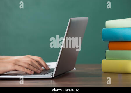 Man Working On Computer At Desk Stock Photo