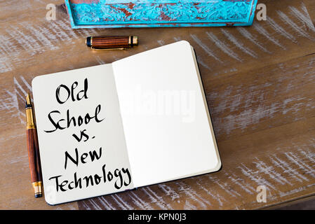 Written text Old School versus New Technology Stock Photo