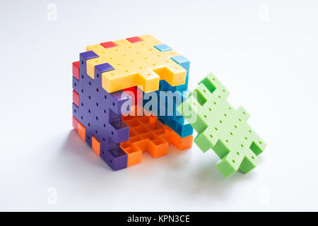 Colorful plastic jigsaw puzzle game Stock Photo