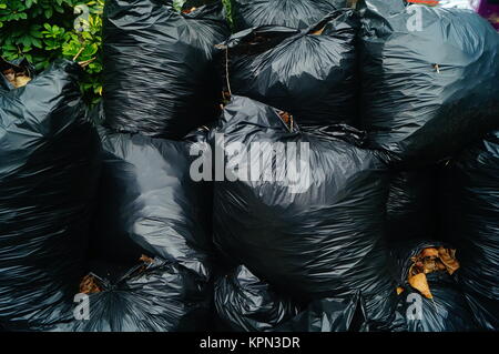 Premium Photo  Close up of trash bags filled with trash after cleaning the  environment.