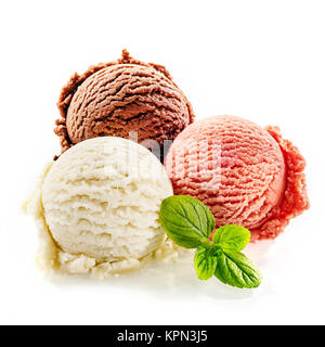 Colorful homemade frozen italian dessert scoops on a white background and decorated with fresh green mint Stock Photo