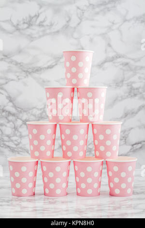 Stacks of Pink Disposable Paper Cups Stock Photo