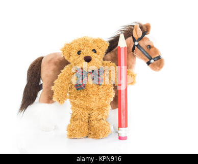 Teddy bear with red pencil and horses Stock Photo