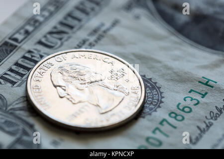 Quarter on US Dollar Bill Stock Photo - Alamy