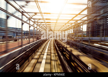 Motion of Japanese mono rail at evening Stock Photo