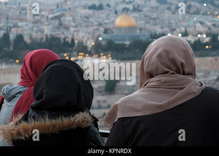 Palestinian women wearing Hijab gazing at Dome of the Rock in the Temple Mount known to Muslims as the Haram esh-Sharif in the Old City East Jerusalem Israel Stock Photo