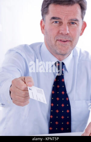 Model release , Geschaeftsmann mit Visitenkarte in der Hand - business man with business card Stock Photo