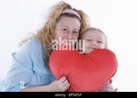 Model release , Mutter und Tochter mit Stoffherz, Muttertag - mother and daughter with heart Stock Photo