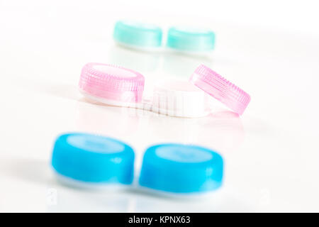 blue and pink plastic contacts case on the white background Stock Photo