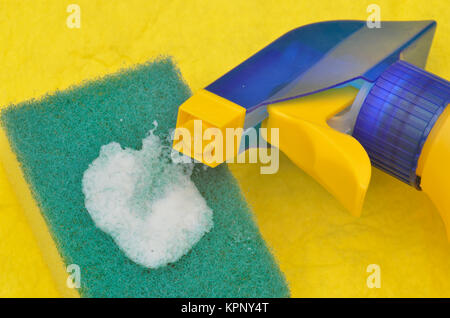cleaning bottle and sponge in close up Stock Photo