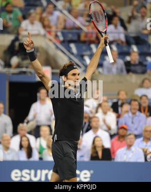 FLUSHING NY- SEPTEMBER 04: Roger Federer defeats Gael Monfils Day ten of the 2014 US Open at the USTA Billie Jean King National Tennis Center on September 3, 2014 in the Flushing neighborhood of the Queens borough of New York City   People:  Roger Federer Stock Photo