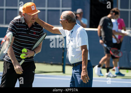 FLUSHING NY- AUGUST 28: Boris Becker, Nick Bollettieri is sighted Day Four of the 2014 US Open at the USTA Billie Jean King National Tennis Center on August 28, 2014 in the Flushing neighborhood of the Queens borough of New York City.   People:  Boris Becker, Nick Bollettieri Stock Photo