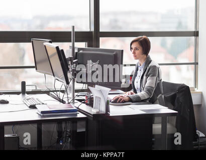 Business woman working in corporate office. Stock Photo