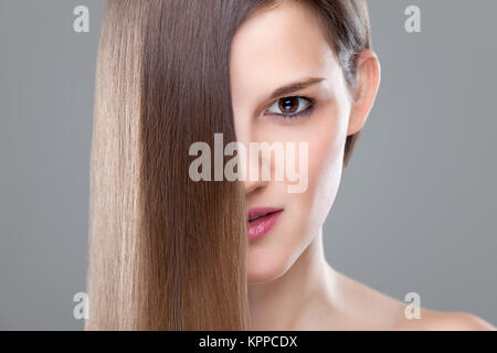 Beautiful brunette with long straight hair Stock Photo