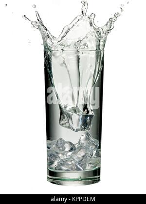 ice cube splashed in glass of water Stock Photo