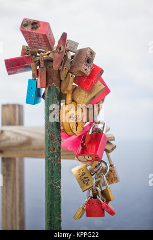Colorful love locks on a chain Stock Photo