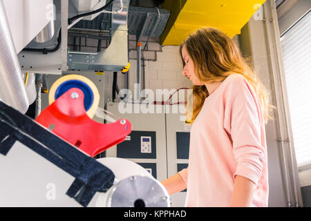 Young Female Girl Engineer Printing Specialist Gravure Intaglio Printing Industrial Machine Packaging Newspaper Mass Industrial Production Stock Photo