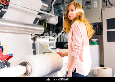 Young Female Girl Engineer Printing Specialist Gravure Intaglio Printing Industrial Machine Packaging Newspaper Mass Industrial Production Stock Photo
