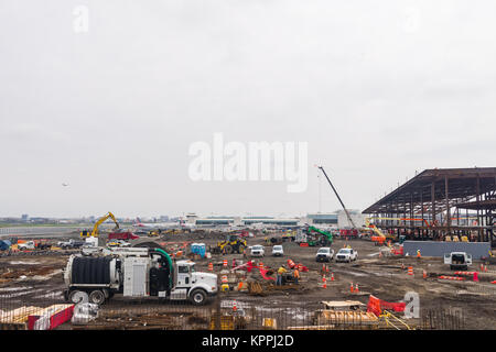 Construction equipment and workers building the new terminal at La Guardia airport in Queens, New York, USA Stock Photo