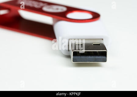 Close-up view of a white USB Flash Drive connector with red cap, on a white background Stock Photo