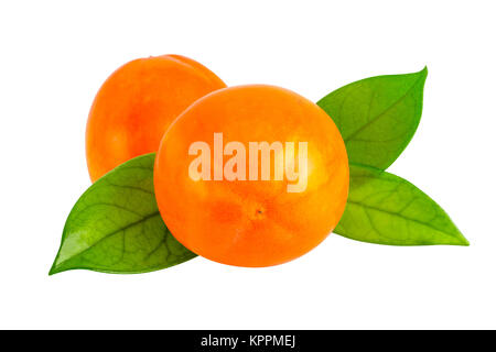 Kaki persimmon on white with clipping path. Two persimmon fruits with leaves in close-up Stock Photo