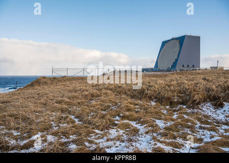 The COBRA DANE radar is a single faced ground-based, L-band phased-array radar  located at Eareckson Air Station, Shemya, Alaska. The primary mission of COBRA DANE is to collect radar metric and signature data on foreign ballistic missile events. Additional missions include collecting space surveillance data on new foreign launches and satellites in low-earth orbit. The radar has a 95-foot diameter phased array and the capability to track and record data on as many as 120 objects simultaneously. Stock Photo