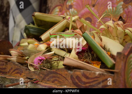 Typical balinese offerings also called Canang Sari inside Goa Gajah hindu temple in Bali - Indonesia Stock Photo